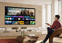 Image of guy using smart tv in saloon